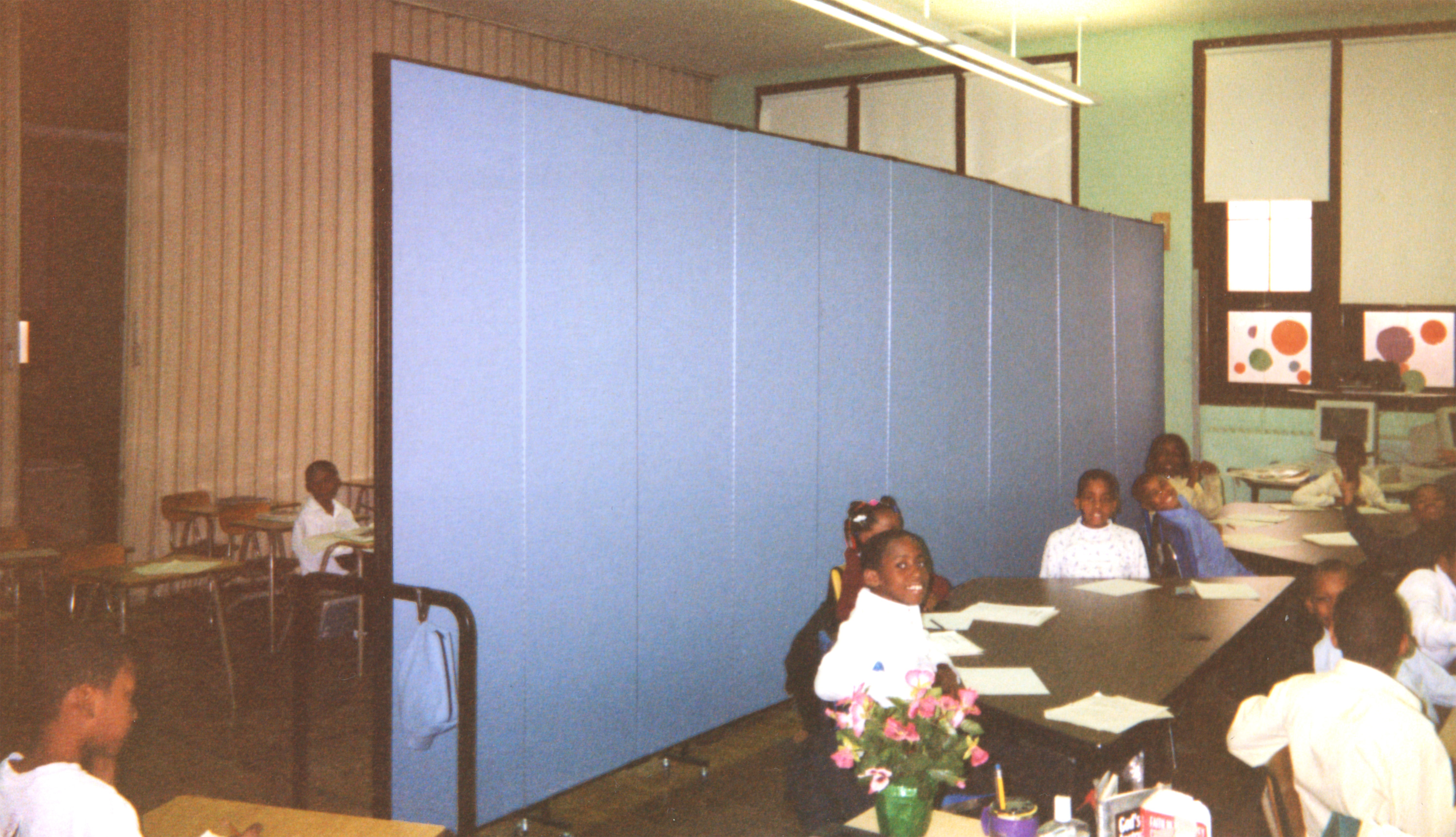 Acoustical Wallmount dividers help make the best use of space in overcrowded schools