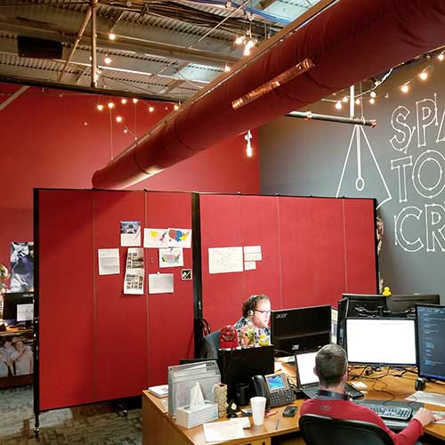 red divider separating an open office